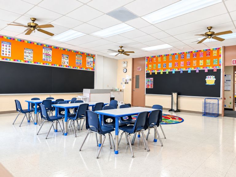 St. Luke's classroom with tables and blue chairs