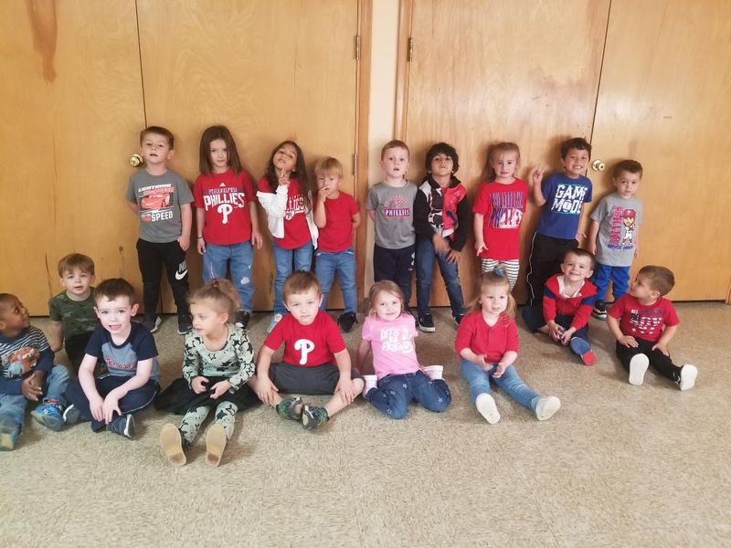 Children wearing red for Phillies Day posing for a group photo