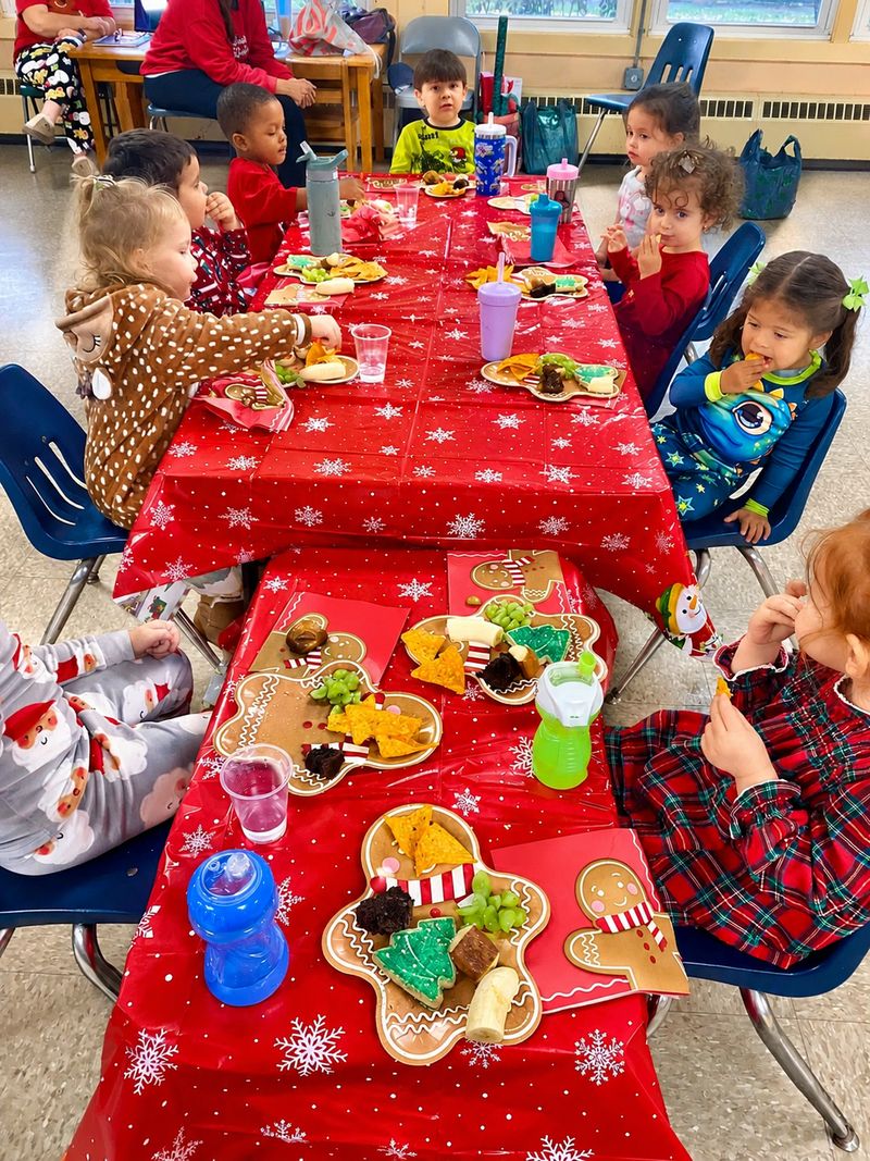 St. Luke's children enjoying snack time together at the table